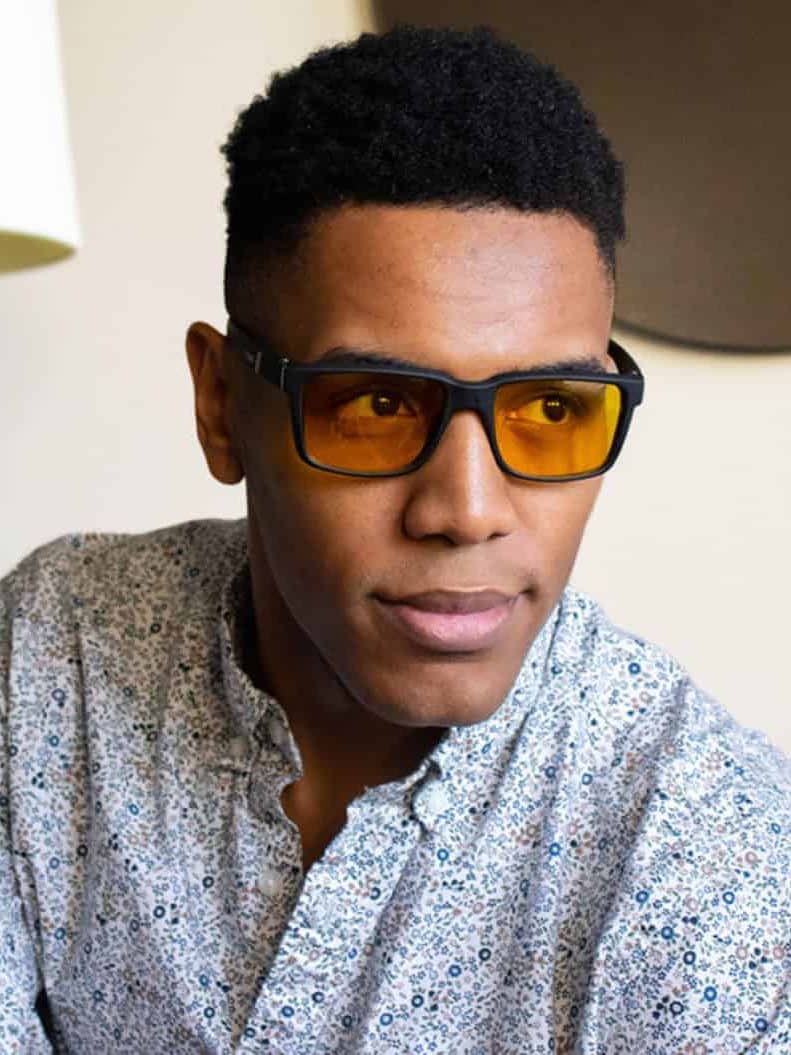 Young black man wearing TrueDark glasses