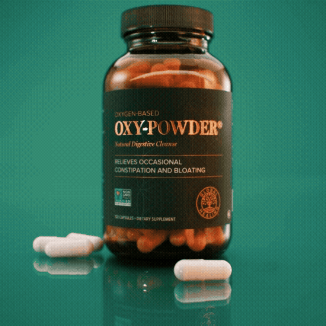 A bottle of Oxy-Powder digestive cleanse capsules on a teal background, with a few capsules scattered next to it. The label highlights its benefits for relieving occasional constipation and bloating.