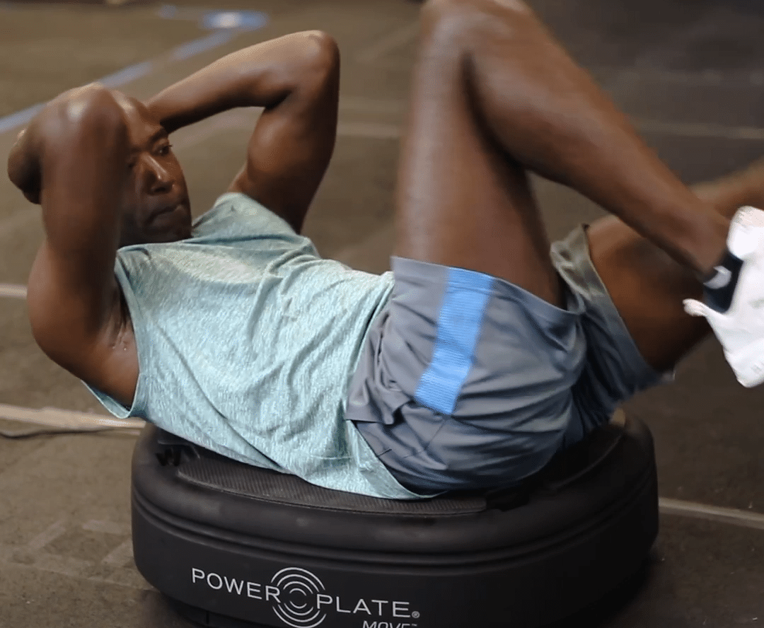 Man doing crunches on Power Plate